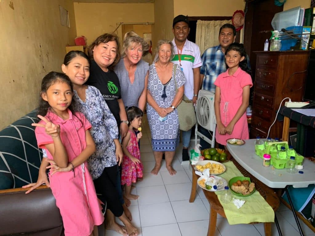 Jun 2022 Michelle with Pastor Edwuard from 2025 December Newsletter.