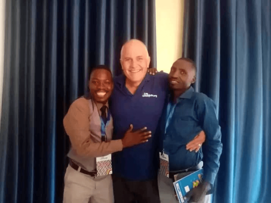 Live Connection team member with two pastors at a gathering.